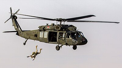 Maritime Raid Force conduct military freefall parachute operations from a UH-60 Black Hawk