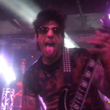 Gruft performing with Escape the Fate in 2017