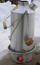 A Kelly kettle, designed to efficiently use the heat of a small fire in a chamber at the base