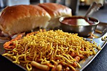 Misal pav topped with Indian snack noodles
