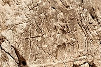 Sarpol-e Zahab, relief I. Beardless warrior with axe, trampling a foe. Sundisk above. A name "Zaba(zuna), son of ..." can be read. He is usually considered as a ruler of the Lullubi,[35][36] but he could be a ruler of the Kingdom of Simurrum, son of Iddin-Sin.[7]