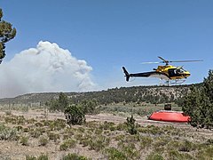Helicopter procuring water to fight the fire on June 29