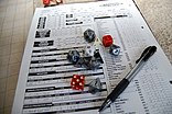 Dice on top of a Character Sheet