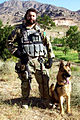 A U.S. Air Force Security Forces dog handler attached to the Army's 3rd Special Forces Group in Afghanistan with a German Shepherd