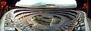 A tulou outer building encloses a smaller circular building, which encloses an ancestral hall and courtyard in the center.