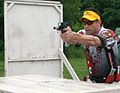 An Open division practical pistol shooter during a stage.