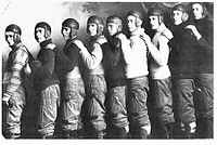 Unknown American football team, ca. 1910's. Their "dog-ear" helmet style came into fashion around 1915.