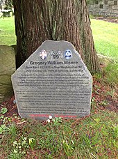 A photograph of Moore's memorial headstone
