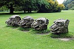4 Stone Dragons Heads on Lawn East of Hall