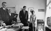 President Kennedy watching the flight on TV together with the First Lady, Vice President Johnson and others