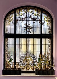 Rococo Revival festoon on a stained-glass window in the orangery of the Ecaterina Procopie House (Strada Bocșa no. 4), Bucharest, unknown architect or painter, c.1912[16]