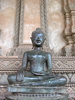 "the Buddha calling the earth to witness", The Buddha's hands are in the bhūmisparsa mudrā (subduing Māra) position. Ho Phra Kaeo temple, Vientiane, Laos