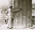 Base of a Doric column, Parthenon, embraced by Frank G. Carpenter