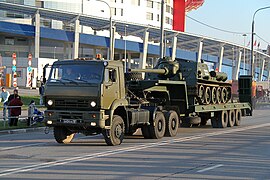 A Russian Army KamAZ military tank transporter carrying an SU-85M