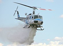 Kern County (California) Fire Department Bell 205 dropping water during a training exercise at the Mojave Spaceport