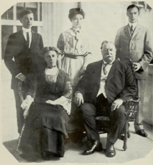 William and Helen Taft sit in the foreground while their three adult children stand behind them