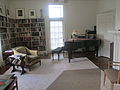 Sandburg parlor with piano; the Sandburgs were devotees of singing and musical instruments.