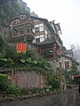 Hongya Cave stilted houses in traditional Bayu-style architecture