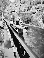 Making repairs aboard a flume boat.