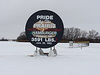 Sign made from the griddle used to cook the World's Largest Hamburger