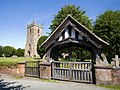 Lychgate and west tower of All Saints' parish church.