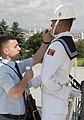Assistant removes perspiration from a guard at Anıtkabir