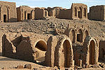 Ancient ruins with arches in a desert setting