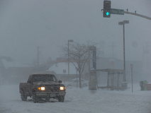 Truck driving through a snowstorm on Main Street in Kansas City, Missouri