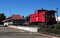 A caboose outside the old L&N railroad depot, now the Walton County Heritage Museum