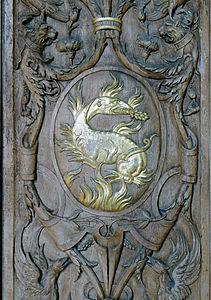 Decorative carved panel in the Gallery of Francis I, with his emblem, the salamander (mid 16th century).