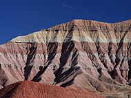 The gray and red colored bands across the landform are typical of most geologic features in the Painted Desert.