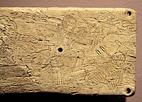 Hunters in an ivory plaque from Takht-i Sangin, with design comparable to the hunting scenes of the Orlat plaques.[12]