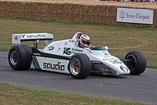 Sideview of a white Williams racing car during a presentation run