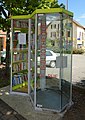 Street library, made with a telephone booth, in Giromagny, France