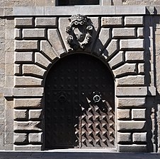 Keystone much enlarged for decorative effect, and carrying a coat of arms, Barcelona