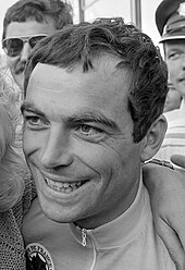Black-and-white photo of Hinault's face, smiling