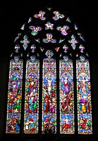 William Wailes. This window has the bright pastel colour, wealth of inventive ornament, and stereotypical gestures of windows by this firm. St Mary's, Chilham