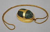 Heart scarab of Hatnefer; 1492–1473 BC; serpentine (the scarab) and gold; 5.3 × 2.8 cm; chain: 77.5 cm; Metropolitan Museum of Art