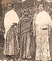 Bride flanked by two women in parsi, 1941
