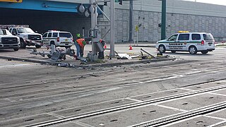 Wrecked crossing signals at the site of the Lake Worth Beach accident
