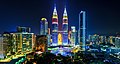 The Petronas Towers illuminated with the colours of the Malaysian flag