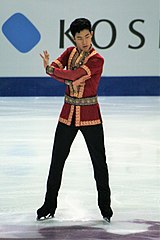 A photograph of Nathan Chen in the starting position of his free program at the 2016 Grand Prix Final