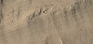 Color view of grooves on wall of Kasei Valles, as seen by HiRISE under HiWish program. Grooves may be caused by water moving in the channel.
