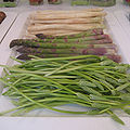 Three types of asparagus are on display, with white asparagus at the back and green asparagus in the middle. The plant at the front is Ornithogalum pyrenaicum, commonly called wild asparagus, and sometimes Bath asparagus or Prussian asparagus.