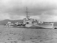 a black-and-white photograph of a warship at sea