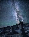 56. Image of the Milky Way Galaxy in the night sky of Drumheller, Canada, on May 21, 2017. Hoodoos can be seen in the foreground.