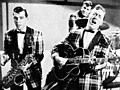 Image 19Bill Haley and his Comets performing in the 1954 Universal International film Round Up of Rhythm (from Rock and roll)