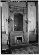 Black-and-white image of the reception room's fireplace