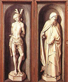 Two figures painted so as to resemble statues
