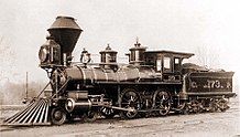 A black-and-white image of an old steam locomotive and tender bearing a resemblance to the DRR's No. 1 locomotive and tender